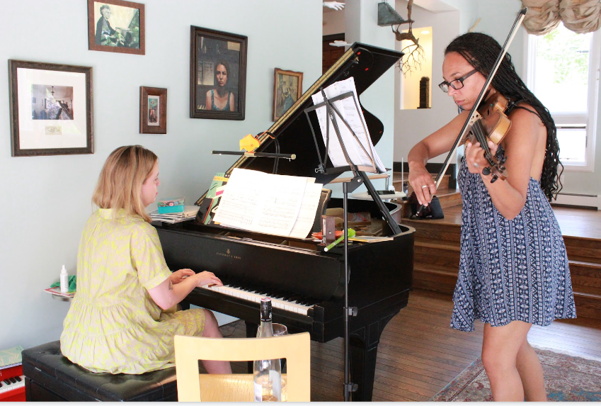 Harriett playing violin with piano student during music lessons in Colorado Springs