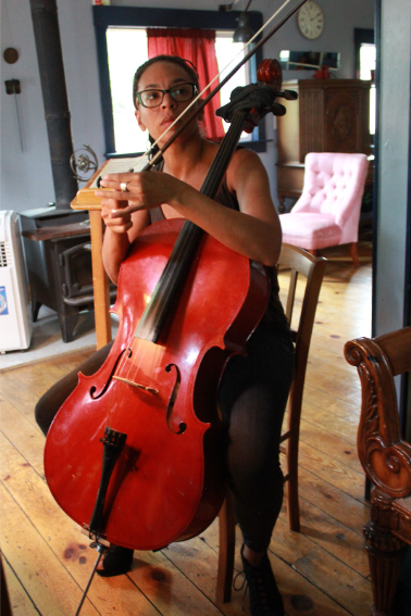 Harriett setting up to play cello during music lessons in Colorado Springs