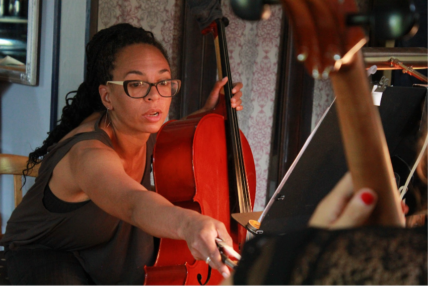 Harriett changing music during music lessons in Colorado Springs